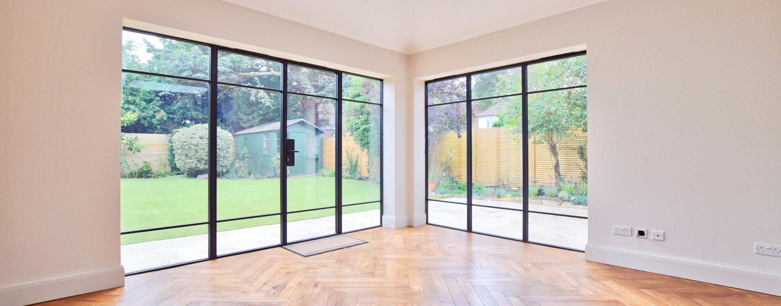 Extension interior with Crittall style glazing and parquet floor